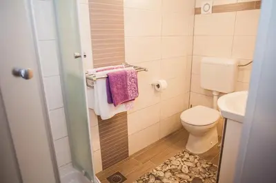 Kupaonica u objektu Gabi Rooms & Studio Apartment