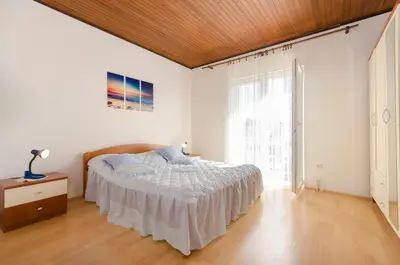 Krevet ili kreveti u jedinici u objektu Apartment and Rooms Ema