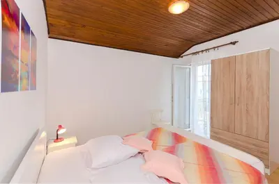 Krevet ili kreveti u jedinici u objektu Apartment and Rooms Ema