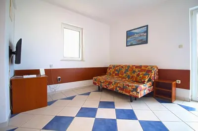 TV i/ili zabavni centar u objektu Apartman Mir
