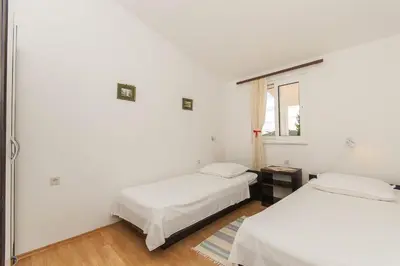 Krevet ili kreveti u jedinici u objektu Apartments Srdan