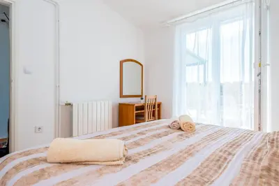 Krevet ili kreveti u jedinici u objektu Apartment and Rooms Dalmatiko