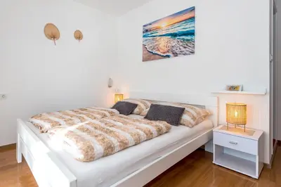 Krevet ili kreveti u jedinici u objektu Apartment and Rooms Dalmatiko