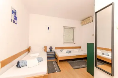 Krevet ili kreveti u jedinici u objektu Apartments and Rooms Mladen