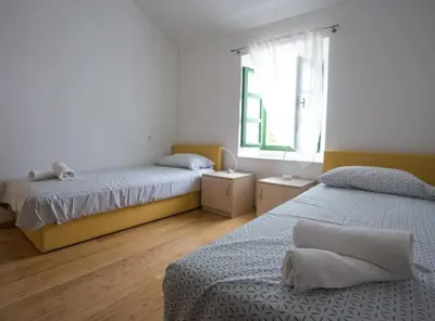 Krevet ili kreveti u jedinici u objektu Apartments Stone House Murter