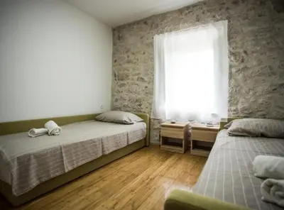 Krevet ili kreveti u jedinici u objektu Apartments Stone House Murter