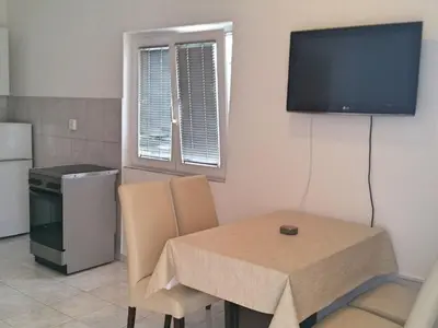 TV i/ili zabavni centar u objektu Apartments Mateo - One Bedroom Apartment - White