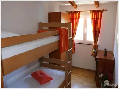 Krevet ili kreveti u jedinici u objektu Apartments Juras - Two Bedroom Apartment with Sea View David