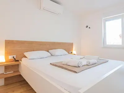 Krevet ili kreveti u jedinici u objektu Holiday Home Iva - Three Bedroom Holiday Home
