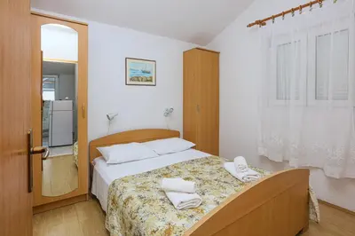 Krevet ili kreveti u jedinici u objektu Apartments by the sea Rogoznica - 24598