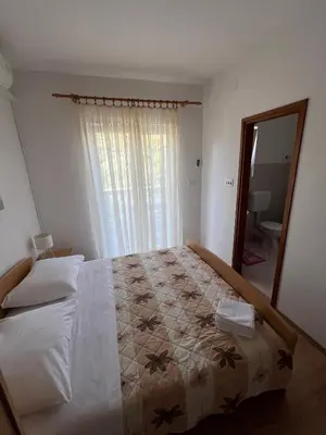 Krevet ili kreveti u jedinici u objektu Sunce economy room with kitchenette