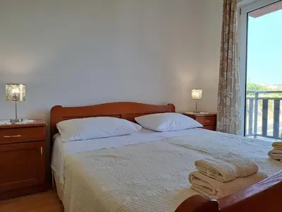 Krevet ili kreveti u jedinici u objektu Apartmani Karmen