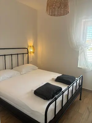 Krevet ili kreveti u jedinici u objektu Villa Regina Apartment Carlito with swimming pool