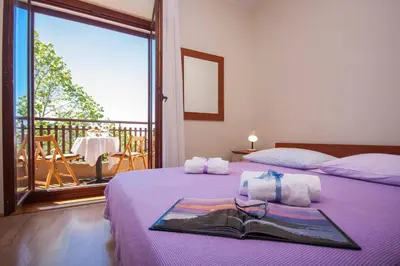Krevet ili kreveti u jedinici u objektu Family Apartments & Rooms Mikelin