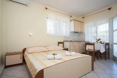 Krevet ili kreveti u jedinici u objektu Family Apartments & Rooms Mikelin