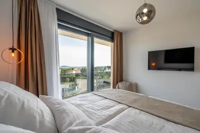 Krevet ili kreveti u jedinici u objektu Moderne Villa in Brodarica mit Meerblick & Pool - bei Šibenik