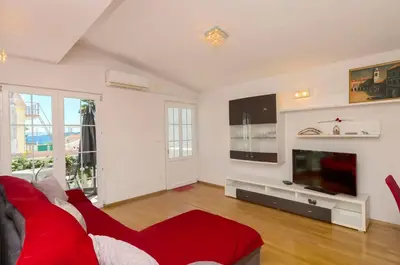 TV i/ili zabavni centar u objektu Apartment Family apartments Ina