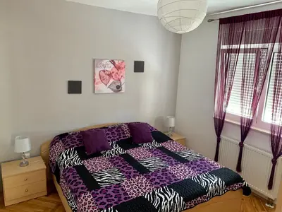 Krevet ili kreveti u jedinici u objektu Modern apartment with an outdoor jacuzzi