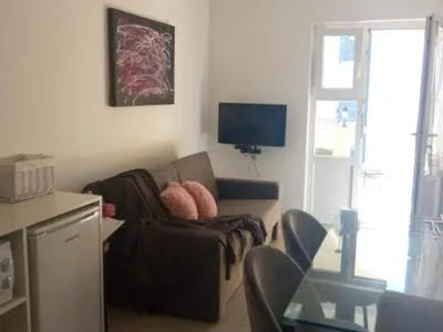 TV i/ili zabavni centar u objektu Cozy Vodice Garden Apartments With Terrace and BBQ - Comfort one bedroom apartment GREEN