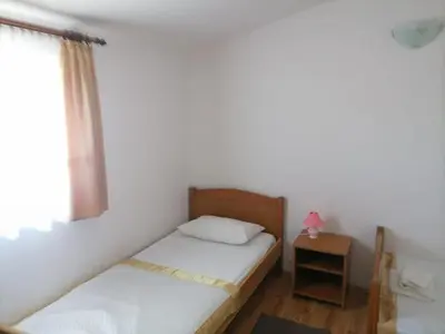 Krevet ili kreveti u jedinici u objektu Apartments Libertas - Two Bedroom Apartment with with Terrace and Sea View 7