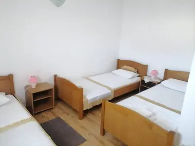 Krevet ili kreveti u jedinici u objektu Apartments Libertas - Two Bedroom Apartment with with Terrace and Sea View 12