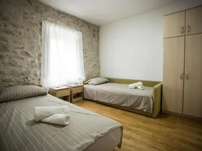 Krevet ili kreveti u jedinici u objektu Apartments Stone House Murter - Two Bedroom Apartment with Balcony