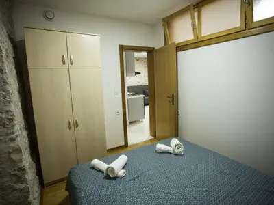 Krevet ili kreveti u jedinici u objektu Apartments Stone House Murter - Two Bedroom Apartment with Balcony