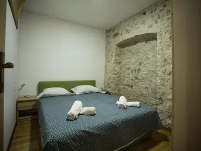 Krevet ili kreveti u jedinici u objektu Apartments Stone House Murter - Two Bedroom Apartment with Balcony