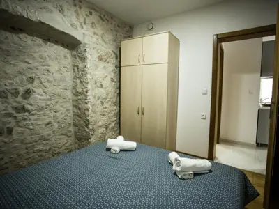 Krevet ili kreveti u jedinici u objektu Apartments Stone House Murter - Two Bedroom Apartment with Balcony