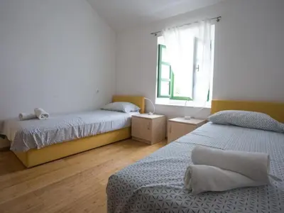 Krevet ili kreveti u jedinici u objektu Apartments Stone House Murter - Two Bedroom Apartment with Terrace