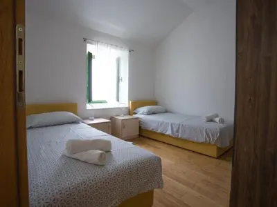 Krevet ili kreveti u jedinici u objektu Apartments Stone House Murter - Two Bedroom Apartment with Terrace