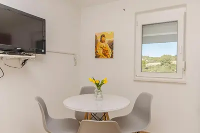TV i/ili zabavni centar u objektu Apartments Nedi