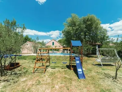 Dječje igralište u objektu Holiday Home Marin AS with Pool
