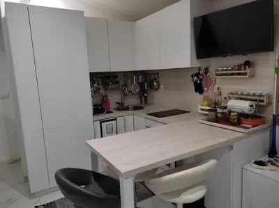 Kuhinja ili čajna kuhinja u objektu Apartments Neve Beachfront
