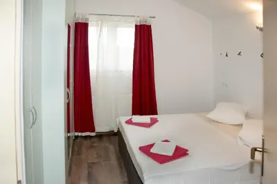 Krevet ili kreveti u jedinici u objektu Apartments with swimming pool Sibenik - 4166