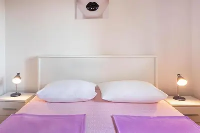 Krevet ili kreveti u jedinici u objektu Apartments Apartmani Marin