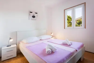 Krevet ili kreveti u jedinici u objektu Apartments Apartmani Marin
