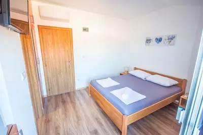 Krevet ili kreveti u jedinici u objektu Apartments and Rooms Skalinada