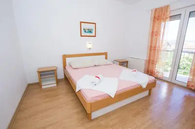 Krevet ili kreveti u jedinici u objektu Apartments and Rooms Skalinada