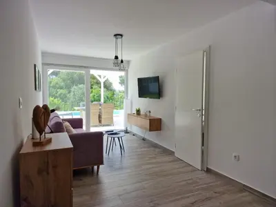 TV i/ili zabavni centar u objektu Holiday Home Großes Ferienhaus zur alleinigen Nutzung mit Pool by Interhome