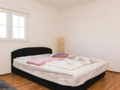 Krevet ili kreveti u jedinici u objektu Apartment Laura mit Pool by Interhome