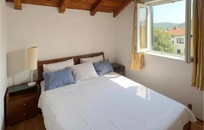 Krevet ili kreveti u jedinici u objektu Nice Apartment In Jezera With House Sea View