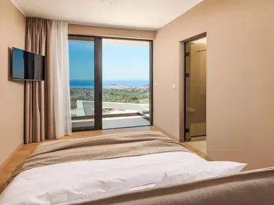 Krevet ili kreveti u jedinici u objektu Villa Five K by Interhome