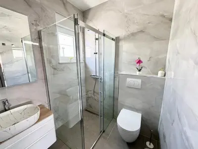 Kupaonica u objektu Apartment Infinito, NEW modern 73m2, sea view