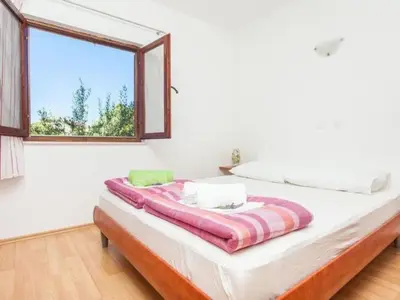 Krevet ili kreveti u jedinici u objektu Apartment in Dvornica mit Gepflegtem Garten by Interhome