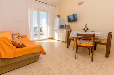 TV i/ili zabavni centar u objektu Beachfront Apartments Lozica