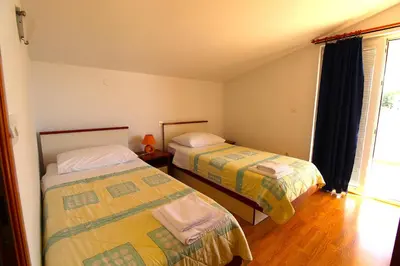 Krevet ili kreveti u jedinici u objektu Primošten Cozy Guest House Helena