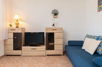 TV i/ili zabavni centar u objektu Puncet Apartments - 2BR with big terrace and BBQ