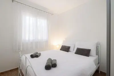 Krevet ili kreveti u jedinici u objektu Puncet Apartments - 2BR with big terrace and BBQ