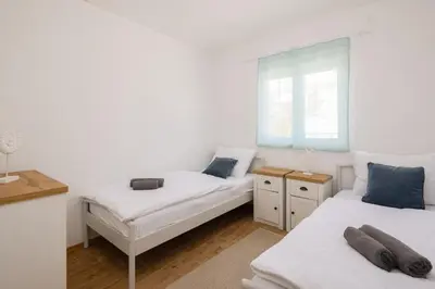 Krevet ili kreveti u jedinici u objektu Puncet Apartments - 2BR with big terrace and BBQ